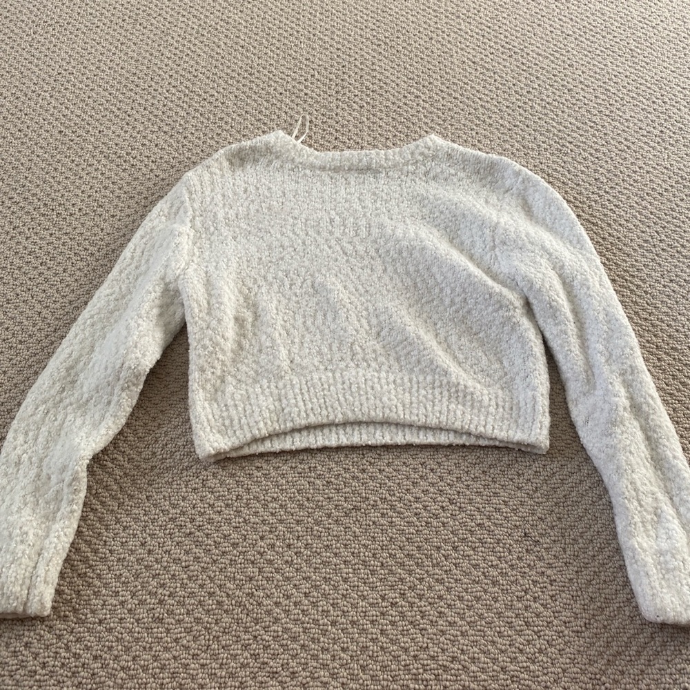 white fuzzy sweater